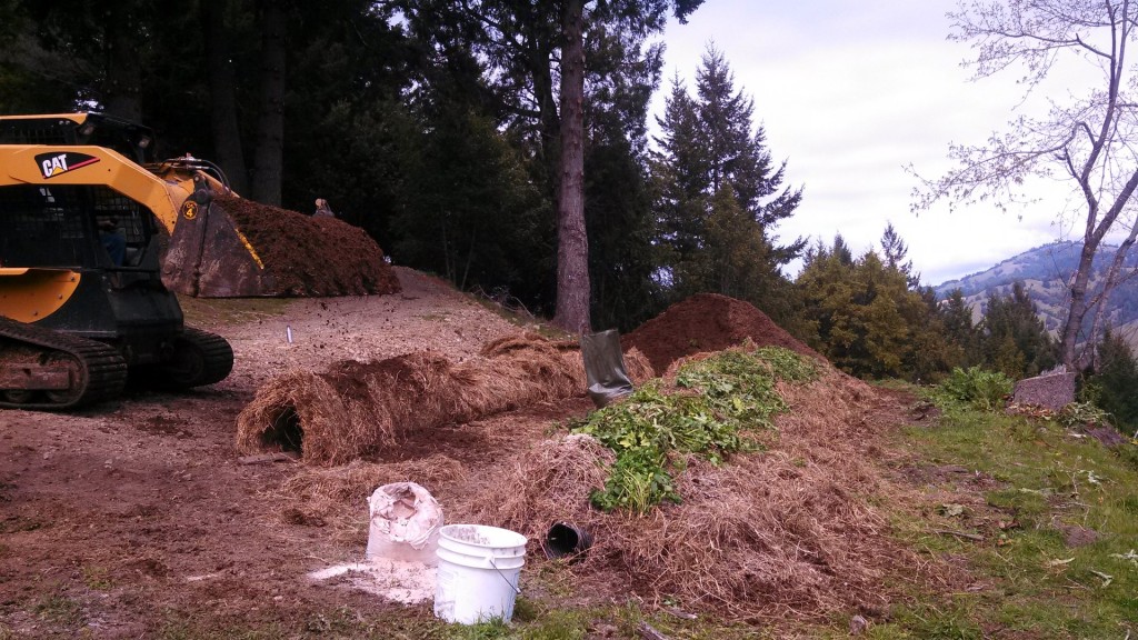Plastic perferated tubes used for the air tunnel are more efficent for large scale compost production as seen here.